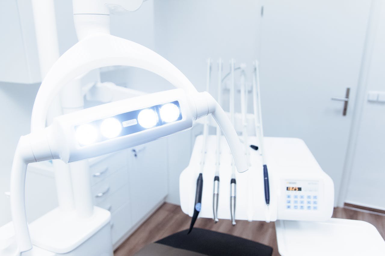 Bright and clean modern dental clinic room with advanced dental equipment.